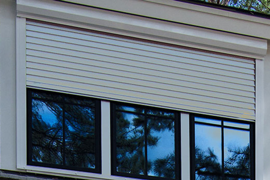 Hurricane shutters protecting a Port Richey home